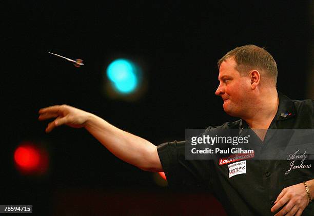 Andy Jenkins of England throws a dart during the first round match between Andy Jenkins of England and Miloslav Navratil of Czech Republic during the...