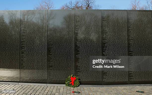 Christmas wreath lays at the Vietnam Veterans Memorial Wall December 20, 2007 in Washington, DC. The Vietnam Veterans Memorial fund held its annual...