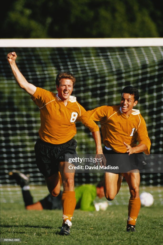 Soccer, players celebrating goal