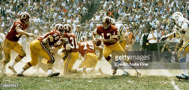 Washington Redskins quarterback Billy Kilmer escapes the pocket during 38-0 victory over the San Diego Chargers on September 16 at RFK Stadium in...