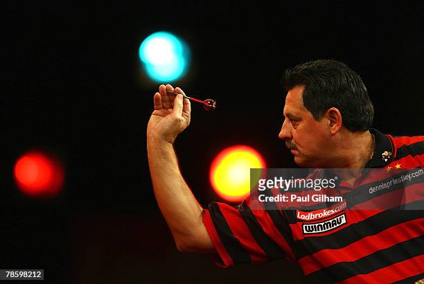 Dennis Priestley of England throws a dart during the first round match between Dennis Priestley of England and Steve Maish of England during the 2008...
