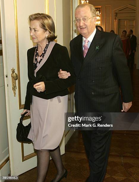 Queen Paola and King Albert from the Belgian Royal Family arrive at the Royal Palace to attend a Christmas concert on December 20, 2007 in Brussels,...