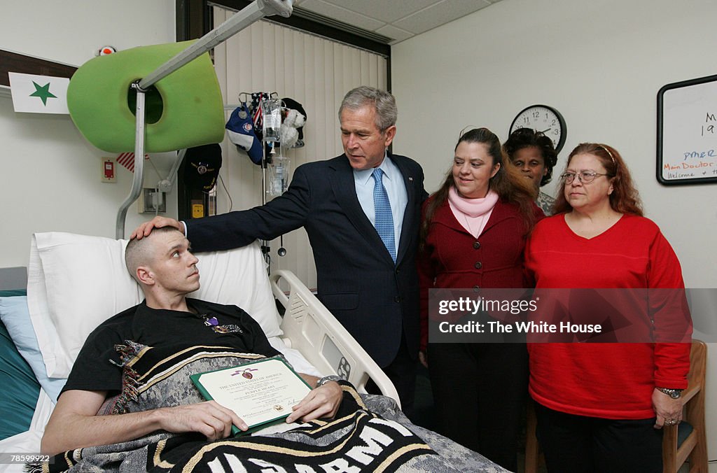 Bush Presents Purple Hearts At Walter Reed