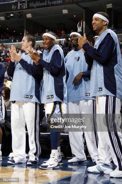 Casey Jacobsen, Tarence Kinsey, Hakim Warrick and Andre Brown of the Memphis Grizzlies cheer on their teammates from the bench during the game...