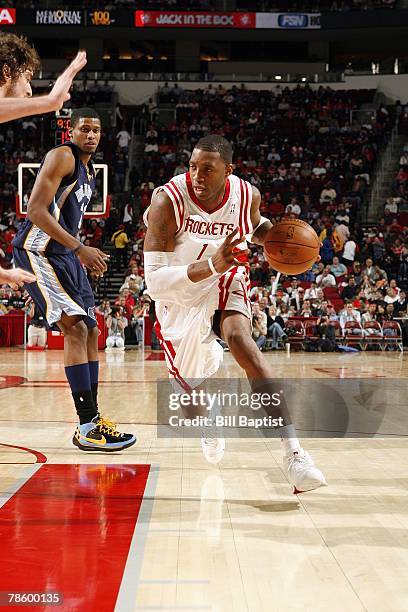 Tracy McGrady of the Houston Rockets drives to the basket during the game against the Memphis Grizzlies at the Toyota Center on December 5, 2007 in...