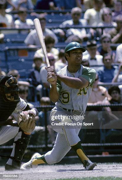 Outfielder Reggie Jackson of the Oakland Athletics swings and watches the flight of his ball during a circa 1960s Major League Baseball game. Jackson...