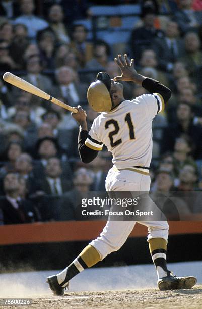 Outfielder Roberto Clemente of the Pittsburgh Pirates swings and watches the flight of his ball against the Baltimore Orioles during the World Series...