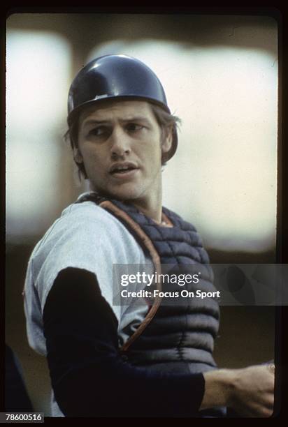 Catcher Carlton Fisk of the Boston Red Sox stands at home plate during a MLB baseball game circa early 1970s. Fisk played for the Red Sox from 1969,...