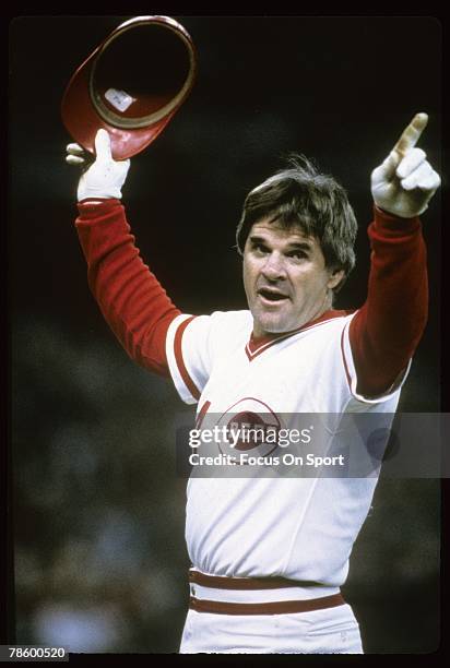 Outfielder Pete Rose of the Cincinnati Reds salutes the crowd after surpassing Ty Cobb with his 4192 hit that came against San Diego Padres pitcher...
