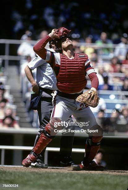 Catcher Carlton Fisk of the Chicago White Sox rips his mask off to chase down a foul ball during a MLB baseball game circa mid 1980s. Fisk played for...