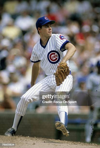 1980s: Pitcher Greg Maddux of the Chicago Cubs pitches during circa mid 1980s Major League Baseball game at Wrigley Field in Chicago, Illinois....