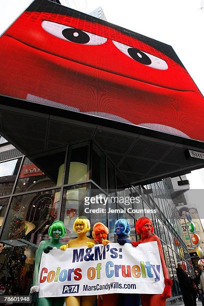 Members of the organization "People for the Ethical Treatment of Animals" also known as PETA stage a "nude" protest in front of the M&M's World...