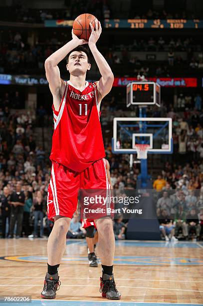 Yao Ming of the Houston Rockets makes his second free throw to go up by one in double overtime with 4.5 seconds left against the Denver Nuggets on...