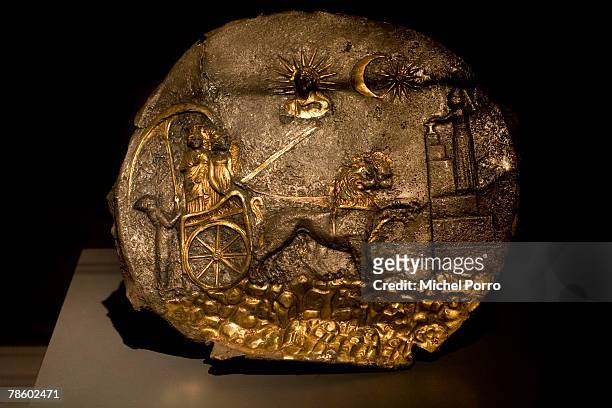 Gilded silver plate with Cybele on a chariot dated 3rd century BC is on display at the 'Hidden Afghanistan' Exhibition on December 20, 2007 in...