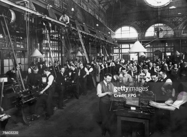 Men at work in a factory, circa 1900.