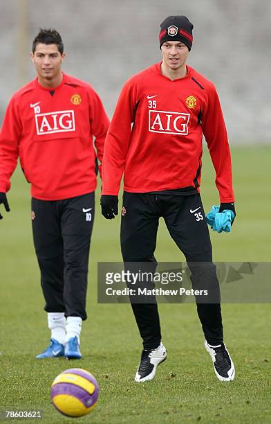 Jonny Evans and Cristiano Ronaldo of Manchester United in action during a First Team Training Session at Carrington Training Ground on December 21...