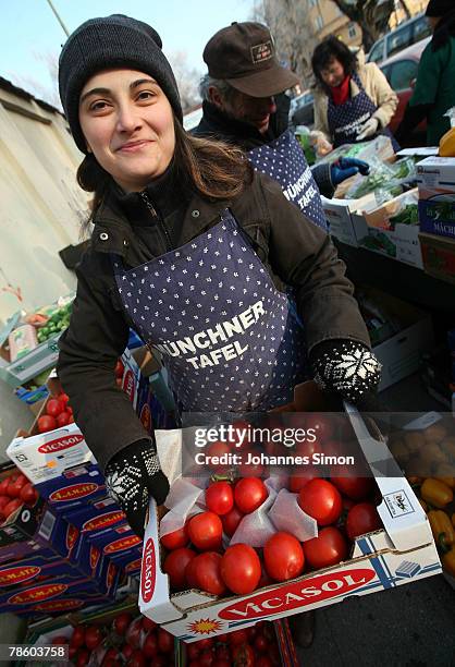 Members of charitable society Muenchner Tafel prepare a soup kitchen outside Capuchin Convent on December 21, 2007 in Munich, Germany. The Muenchner...