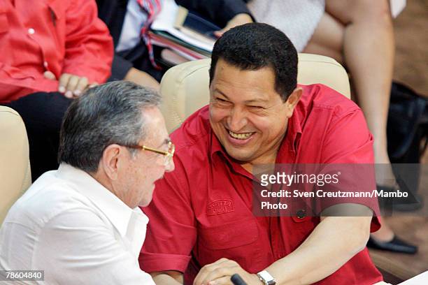 Acting President of Cuba Raul Castro receives a handshake by President of Venezuela Hugo Chavez during the opening session of the 4th PetroCaribe...