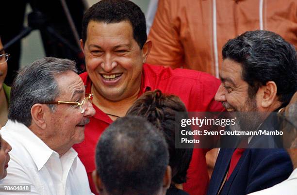 Acting President of Cuba Raul Castro, President of Venezuela Hugo Chavez, and Prime Minister of San Vincent and the Grenadines Ralph Gonsalves talk...