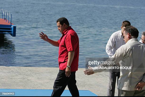 Venezuelan President Hugo Chavez walks towards the dais to pose for the family photograph 21 December, 2007 during the fourth Petrocaribe summit --a...