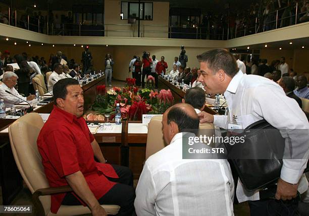 Venezuelan President Hugo Chavez chats with Cuban Foreign minister Felipe Perez Roque and with Vice President Carlos Lage during the inauguration of...