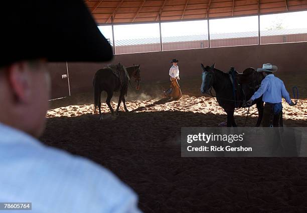 Guthrie Jaguar six man football players Ty Fox, Clint Morgan and Cole Hatfield work their horses on the 6666 Ranch October 24, 2007 in Guthrie,...