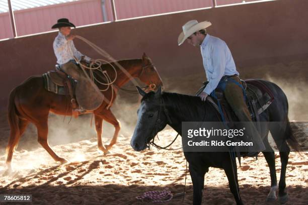 Guthrie Jaguar six man football players Ty Fox and Cole Hatfield work with their horses on the 6666 Ranch October 24, 2007 in Guthrie, Texas. The...