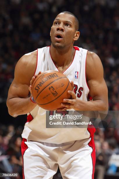 Joey Graham of the Toronto Raptors shoots a free throw during the game against the Phoenix Suns at the Air Canada Centre on December 1, 2007 in...