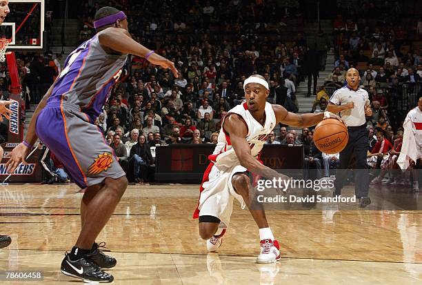 Ford of the Toronto Raptors makes a move against Marcus Banks of the Phoenix Suns during the game at the Air Canada Centre on December 1, 2007 in...