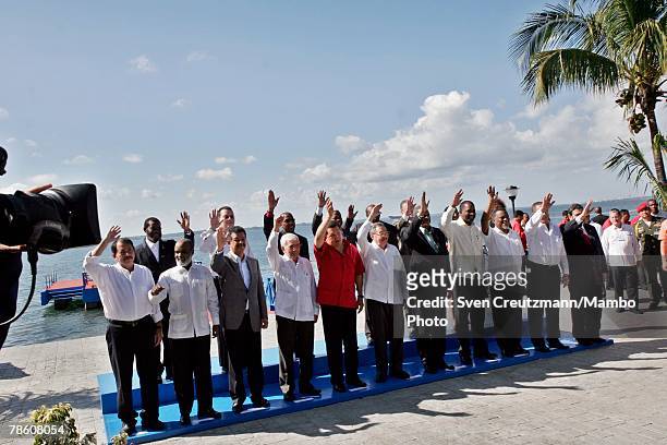 Presidents and Heads of State wave for the press during the traditional formal group photo session during the 4th PetroCaribe Summit at the Jagua...
