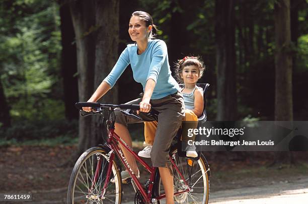 mother and daughter on bike - luggage rack stock pictures, royalty-free photos & images