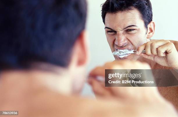 man brushing teeth - toothpaste imagens e fotografias de stock