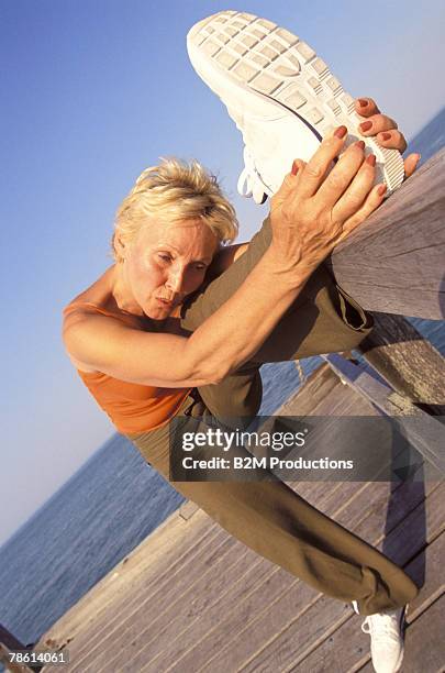 woman stretching at boardwalk - bridge of sigh stock pictures, royalty-free photos & images