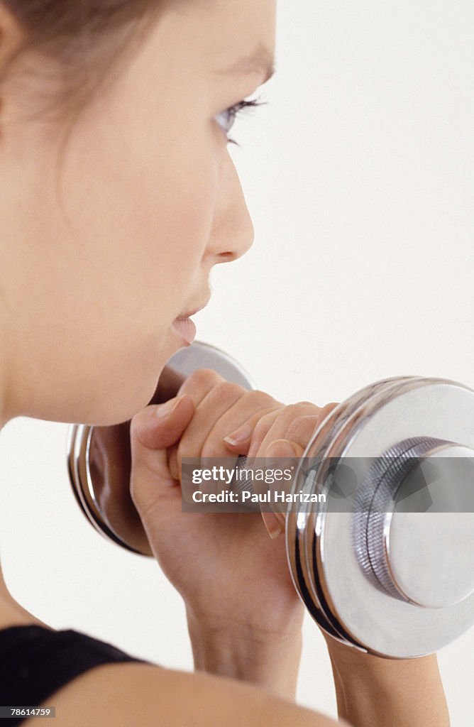 Woman lifting dumbbell