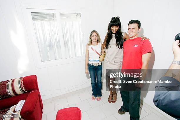 British supermodel and television personality Naomi Campbell meets Yanet Sousa and her husband Frank Suarez, owners of a newly finished home donated...