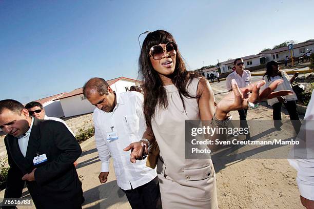 British supermodel and television personality Naomi Campbell visits newly finished houses donated by the Venezuelan government to host Cubans who...