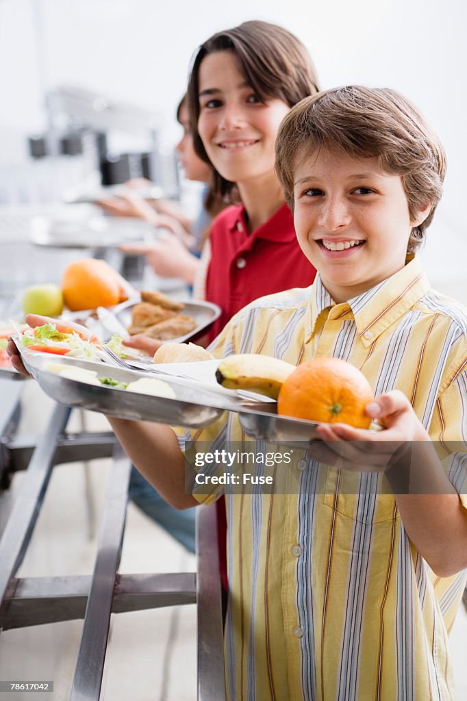 Boys Holding Tray in Cafeteria