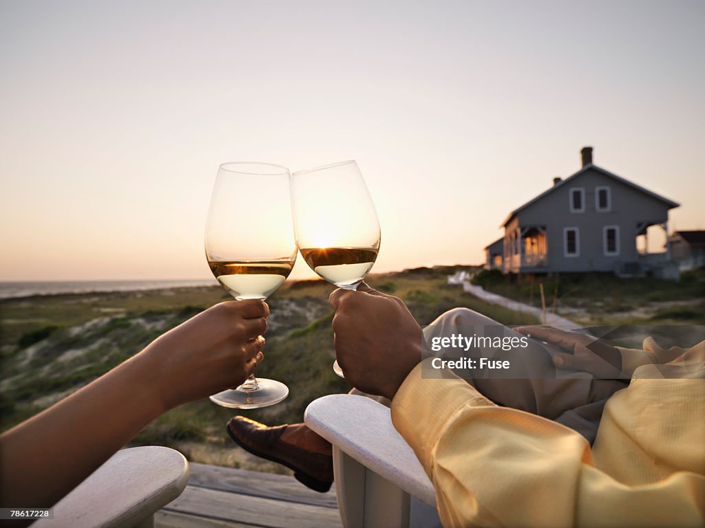 Couple Toasting at Sunset