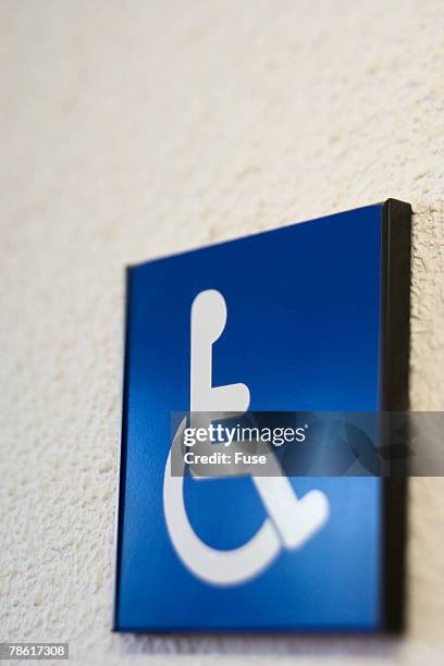 wheelchair access symbol - handicap parking space stock pictures, royalty-free photos & images