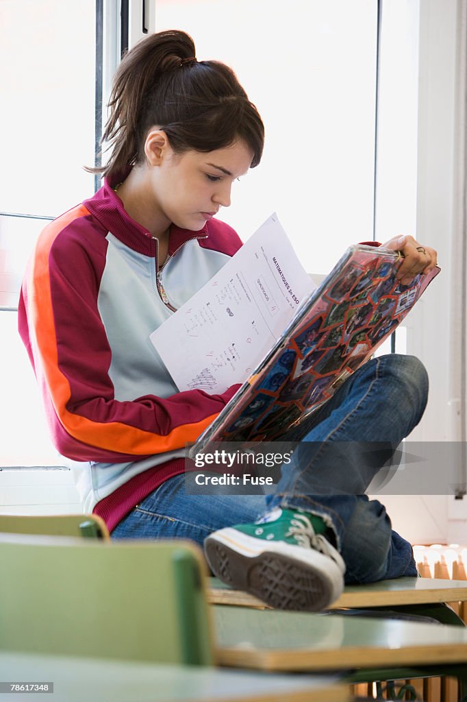 Student Writing In Notebook Student Writing In Notebook High-Res Stock Photo - Getty Images