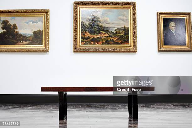 bench and paintings in art gallery - art show stock pictures, royalty-free photos & images