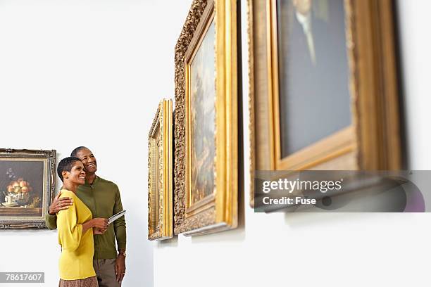 couple at art gallery - art show stock pictures, royalty-free photos & images