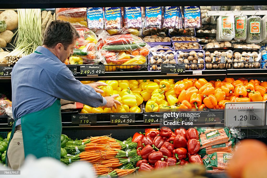 Grocer Stocking Bell Peppers