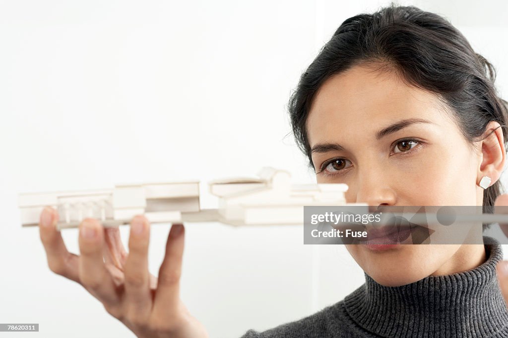 Architect Looking At Model