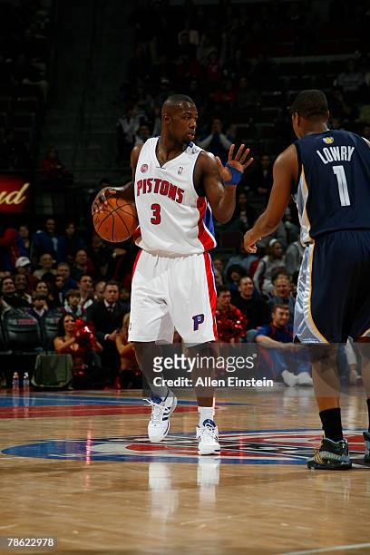 Rodney Stuckey of the Detroit Pistons dribbles the ball against Kyle Lowry of the Memphis Grizzlies on December 21, 2007 at the Palace of Auburn...