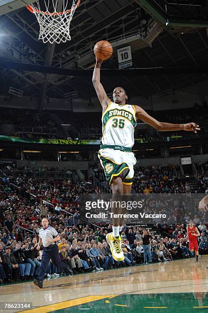 Kevin Durant of the Seattle SuperSonics goes to the basket past the defense of the Toronto Raptors on December 21, 2007 at the Key Arena in Seattle,...