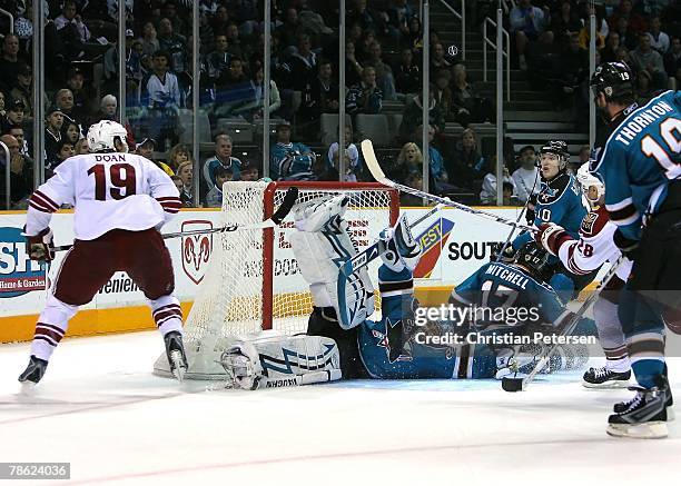 Goaltender Evgeni Nabokov of the San Jose Sharks makes a pad save on shot from Shane Doan of the Phoenix Coyotes during the NHL game at HP Pavilion...