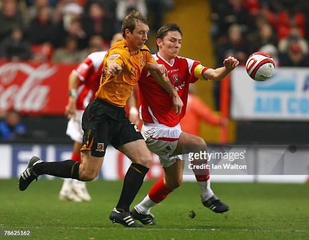 David Livermore of Hull City tries to tackle Matt Holland of Charlton Athletic during the Coca-Cola Championship match between Charlton Athletic and...
