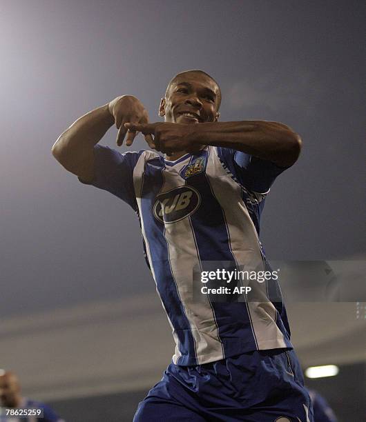 Wigan footballer Marcus Bent celebrates scoring a goal during their Premiership match at Craven Cottage in London, England, 22 December 2007. AFP...