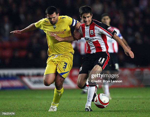 Andrew Surman of Southampton holds off Callum Davidson of Preston North End during the Coca-Cola Championship match between Southampton and Preston...